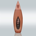 Studio shot of the KA DOS Rosado bottle centered on a gradient white-to-grey background. The sleek, vertically ribbed glass bottle in a warm rosé tone is shaped like an abstract agave leaf with a pointed, faceted cap. A large black KA DOS logo is prominently displayed on the front label, with details in gold and white text about the tequila’s organic origin, volume (700 ml), and alcohol content (40% vol).