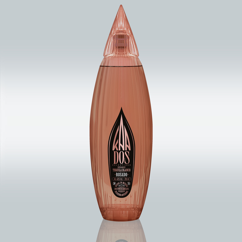 Studio shot of the KA DOS Rosado bottle centered on a gradient white-to-grey background. The sleek, vertically ribbed glass bottle in a warm rosé tone is shaped like an abstract agave leaf with a pointed, faceted cap. A large black KA DOS logo is prominently displayed on the front label, with details in gold and white text about the tequila’s organic origin, volume (700 ml), and alcohol content (40% vol).